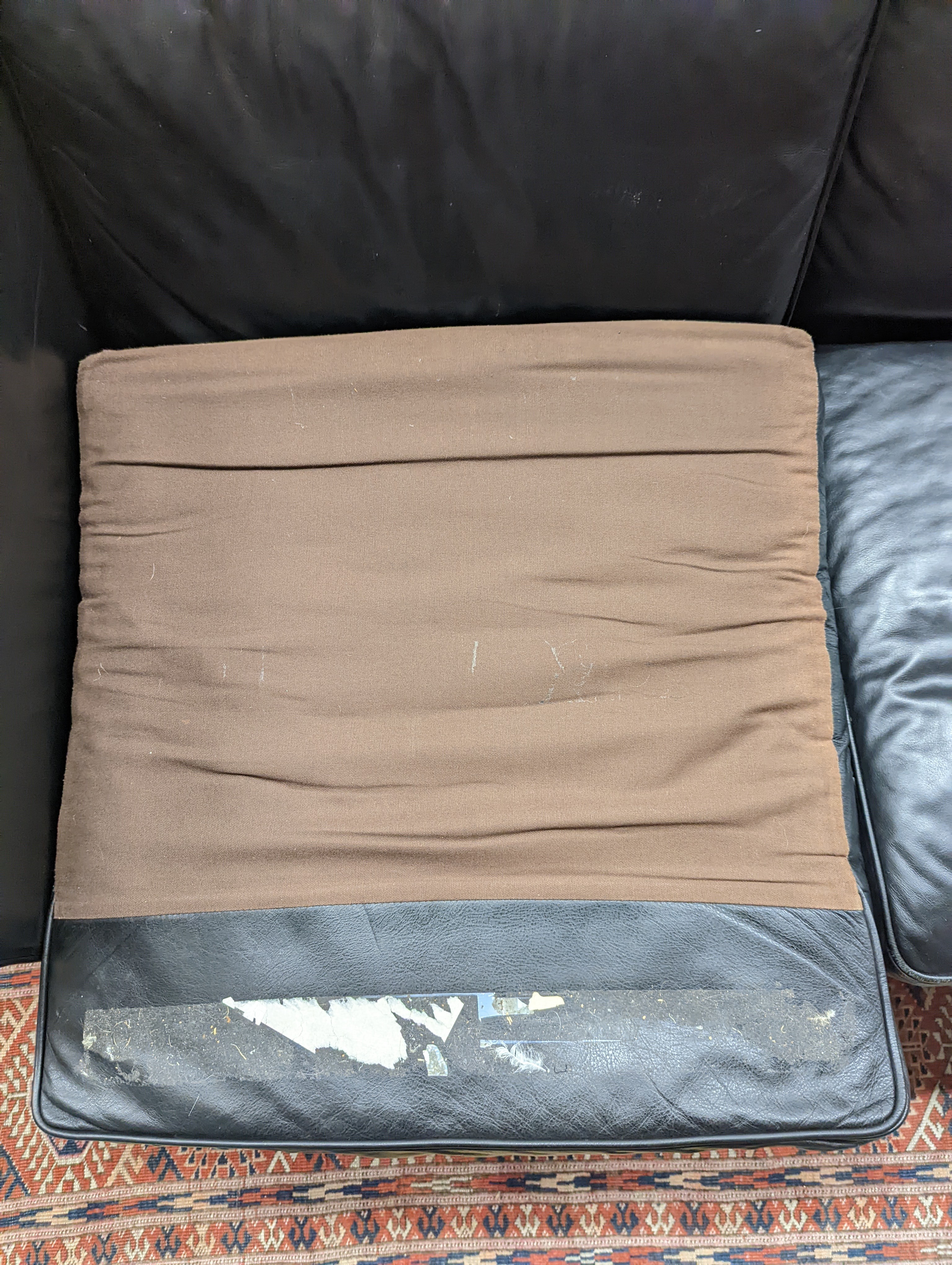 A mid century Danish black leather three seater sofa in the style of Borge Mogensen, length 201cm, depth 80cm, height 76cm
